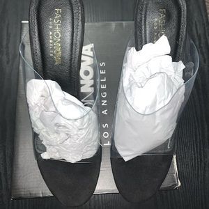 Fashion Nova black and transparent open toe wedge heel.